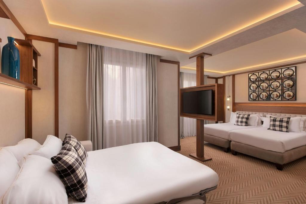 Postel nebo postele na pokoji v ubytování Hotel Ercilla de Bilbao, Autograph Collection