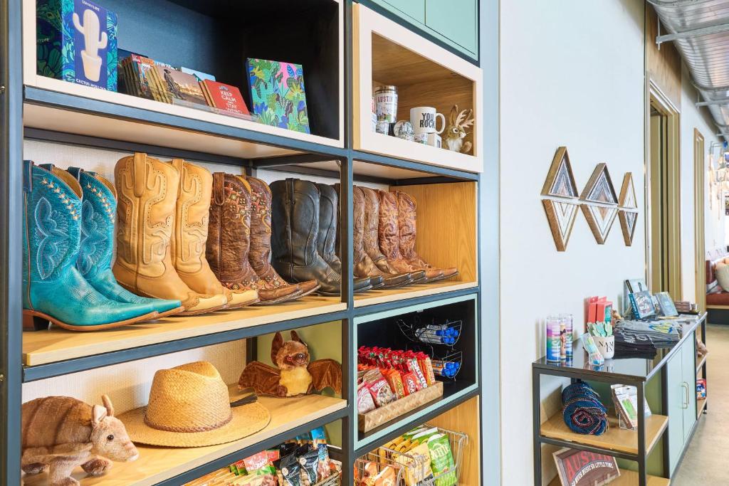 a shelf filled with boots and other items in a store at Aloft Austin Downtown in Austin
