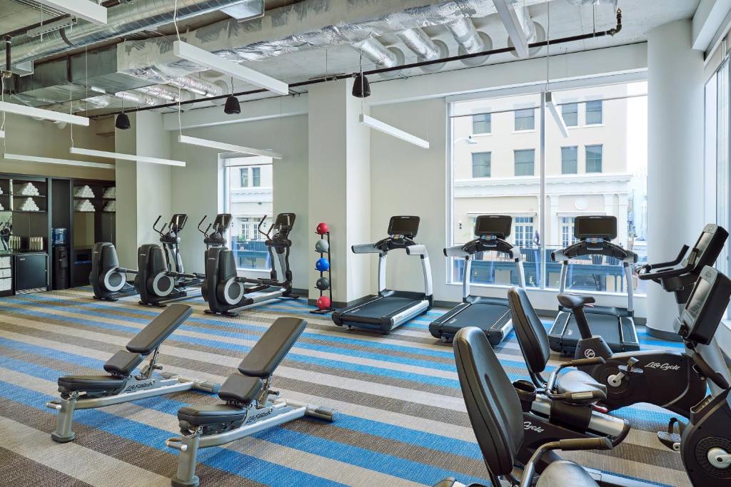 a gym with treadmills and elliptical machines at Aloft Austin Downtown in Austin