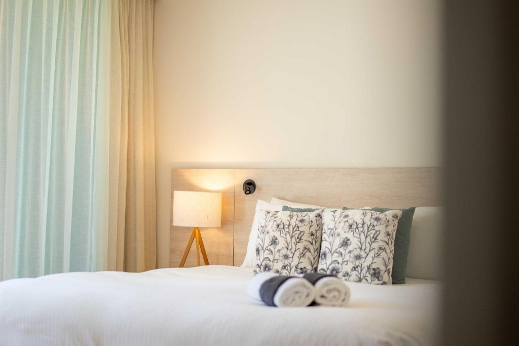 Belle Escapes - Lazy Days on Colley Terrace客房内的一张或多张床位