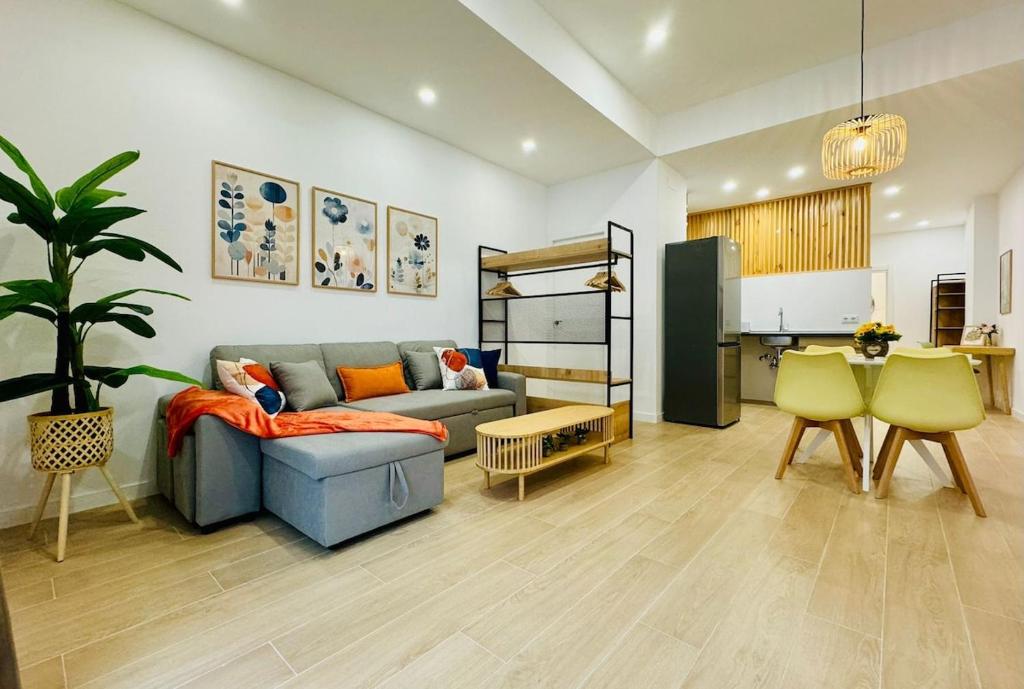 a living room with a couch and a table at LOFT 1 - Space & Conform Close To Center in Valencia