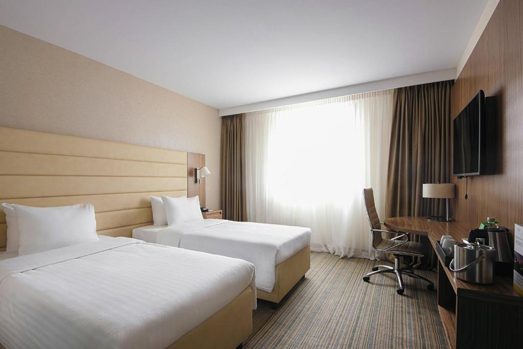 Postel nebo postele na pokoji v ubytování Courtyard by Marriott Belgrade City Center