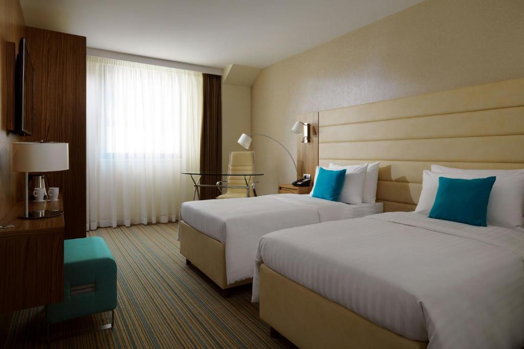 Postel nebo postele na pokoji v ubytování Courtyard by Marriott Belgrade City Center