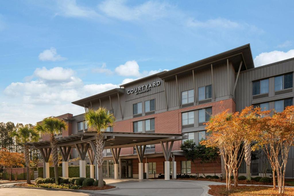 a rendering of a hotel with a building at Courtyard by Marriott Charleston Summerville in Summerville