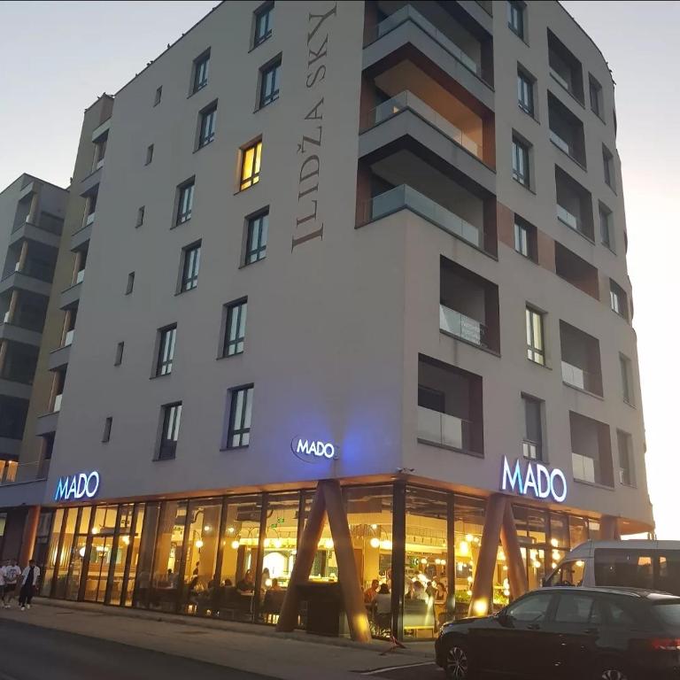 a building with a modo store in front of it at ILiDZA SKY in Sarajevo