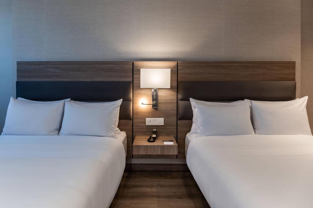 Postel nebo postele na pokoji v ubytování AC Hotel by Marriott Bogota Zona T