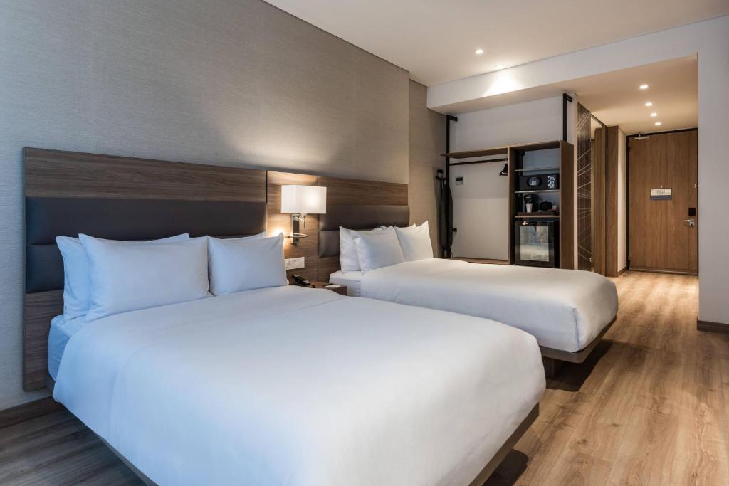 Postel nebo postele na pokoji v ubytování AC Hotel by Marriott Bogota Zona T