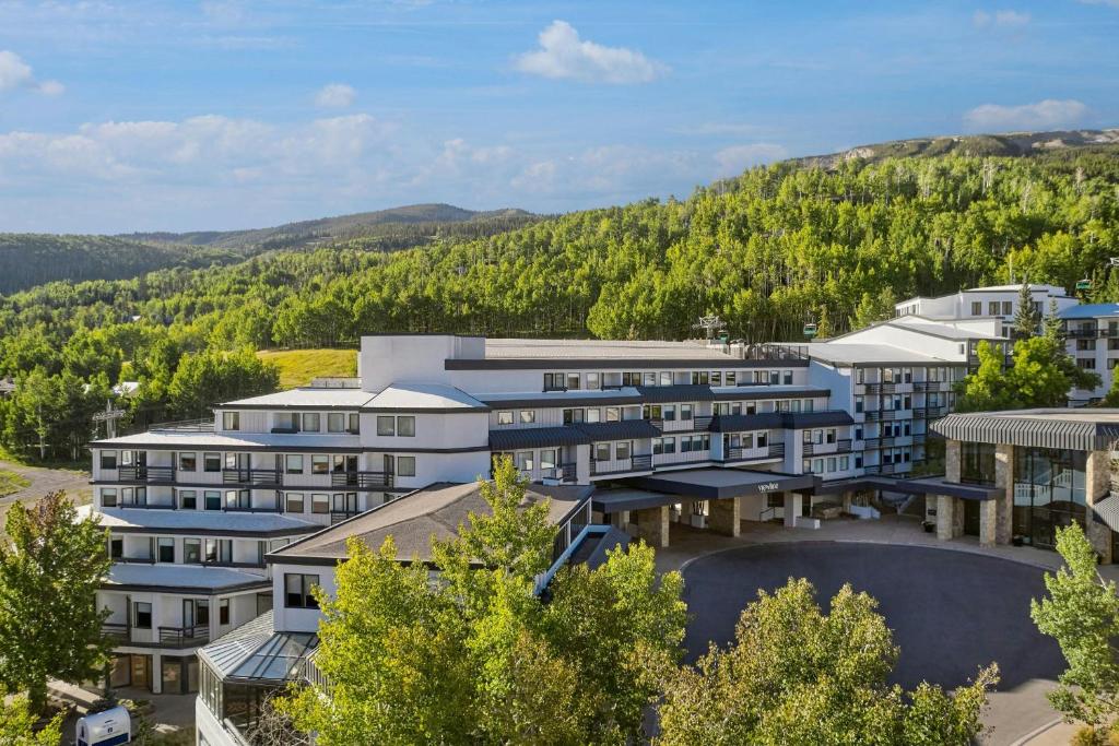 an aerial view of a resort with mountains in the background at Viewline Resort Snowmass, Autograph Collection in Snowmass Village