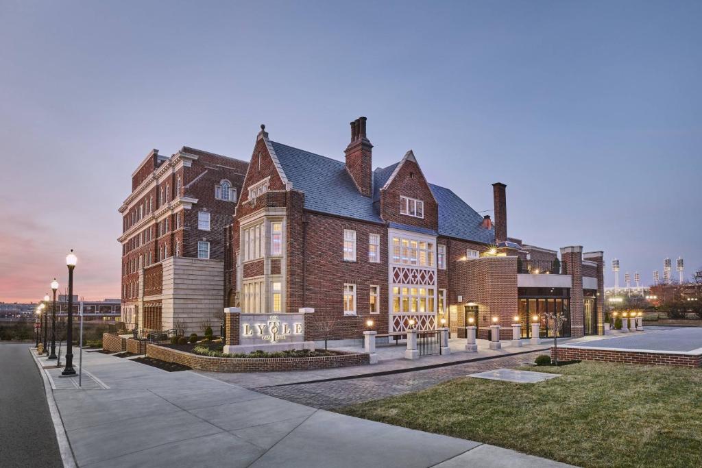 a large brown brick building with a large window at The Lytle Park Hotel, Autograph Collection in Cincinnati