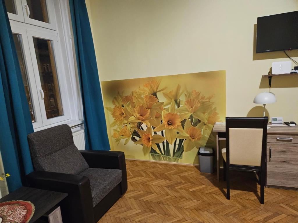 Televízia a/alebo spoločenská miestnosť v ubytovaní Mokka