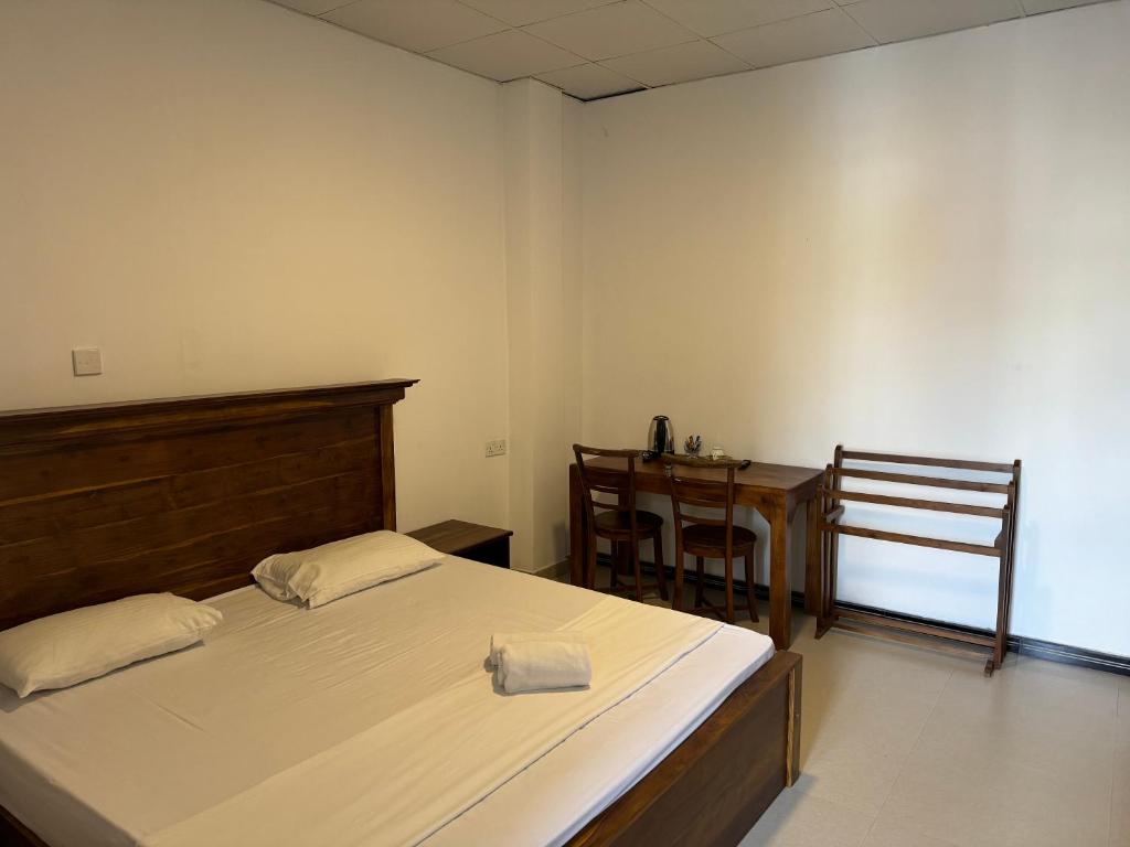 Postel nebo postele na pokoji v ubytování Sky Heaven Hotel