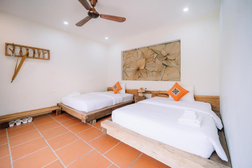 Giường trong phòng chung tại Anans Home Ha Giang - Tours &amp; Motorbike Rental