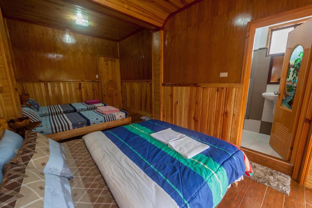 Postel nebo postele na pokoji v ubytování Rice Homestay