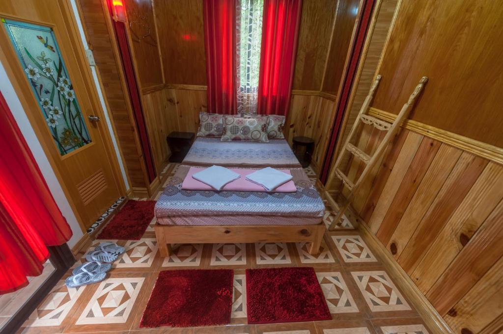 Postel nebo postele na pokoji v ubytování Rice Homestay