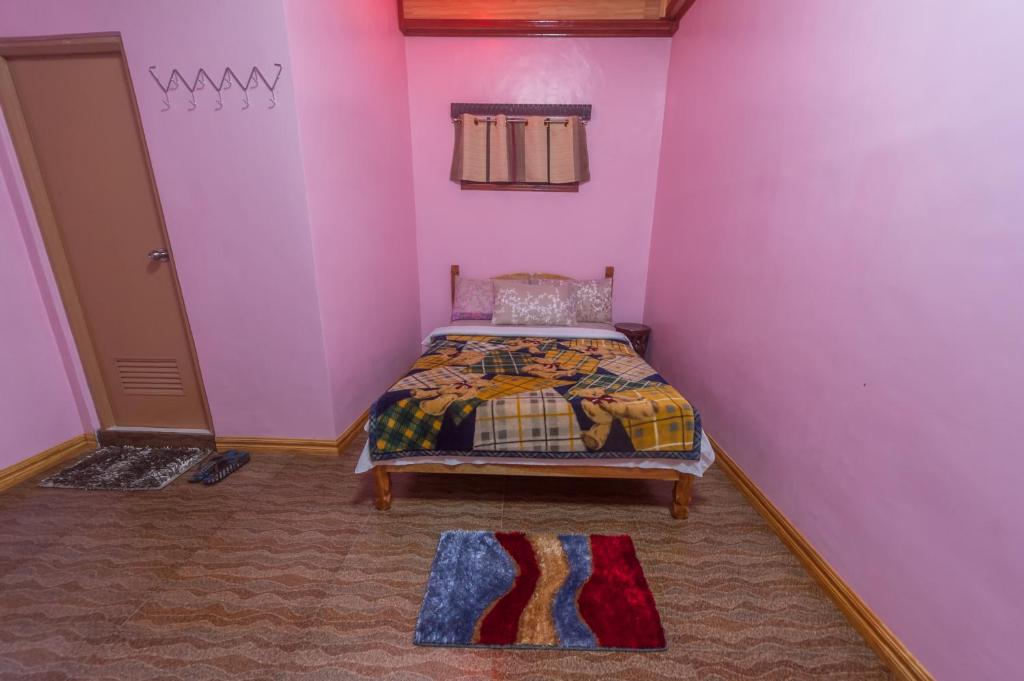 Postel nebo postele na pokoji v ubytování Rice Homestay