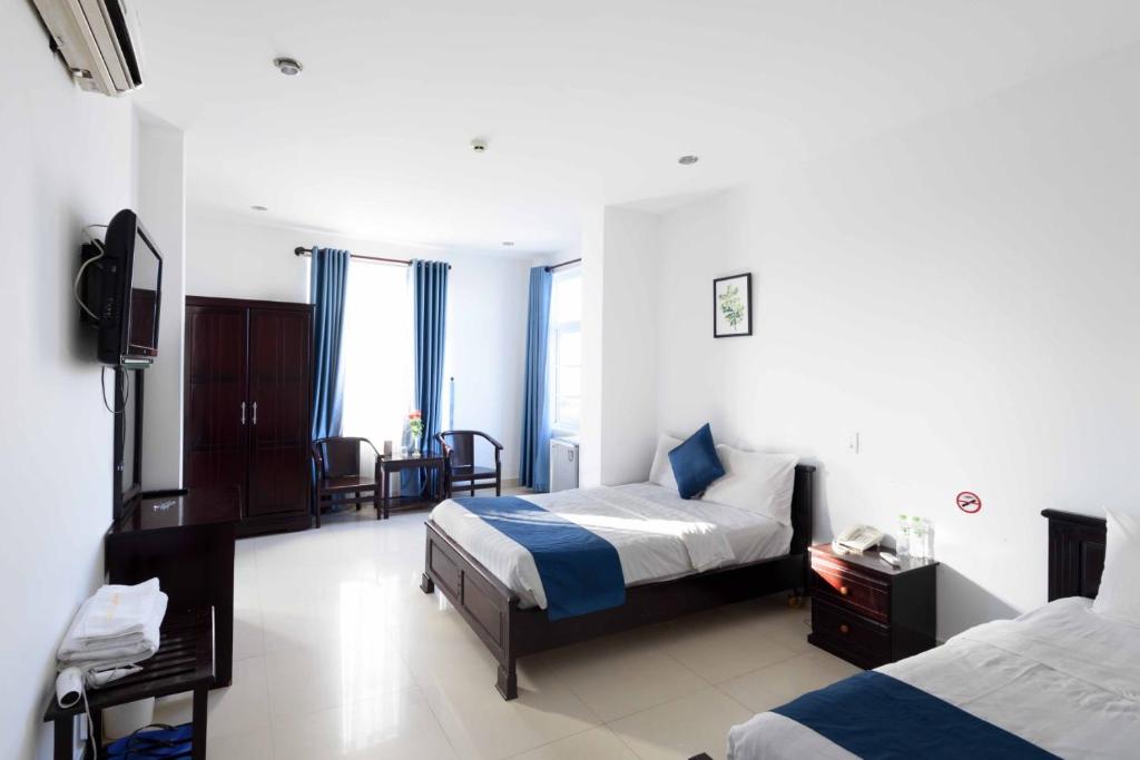 Postel nebo postele na pokoji v ubytování Tehana Beach Hotel Da Nang
