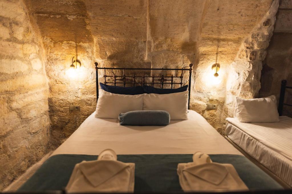 Postel nebo postele na pokoji v ubytování ROCA CAPPADOCIA