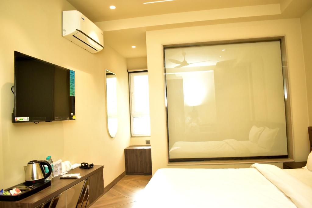 Postel nebo postele na pokoji v ubytování Hotel Cullinan By Qotel Janakpuri