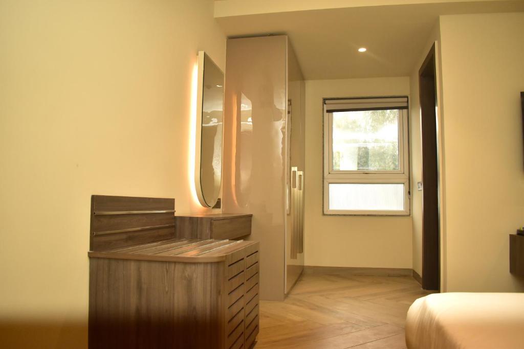 Postel nebo postele na pokoji v ubytování Hotel Cullinan By Qotel Janakpuri