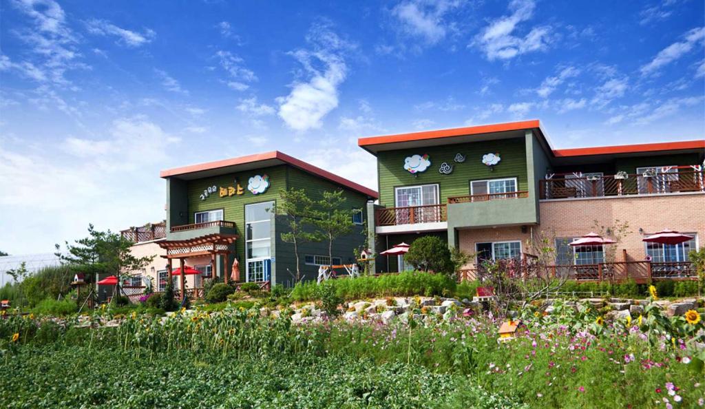 a building with a garden in front of it at Terrace on the Cloud in Pyeongchang