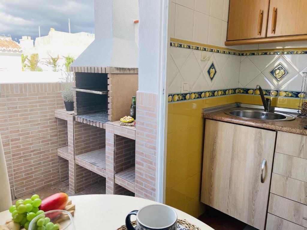 Kuchyň nebo kuchyňský kout v ubytování Apartamento Jimena Sevilla en el centro de Nerja