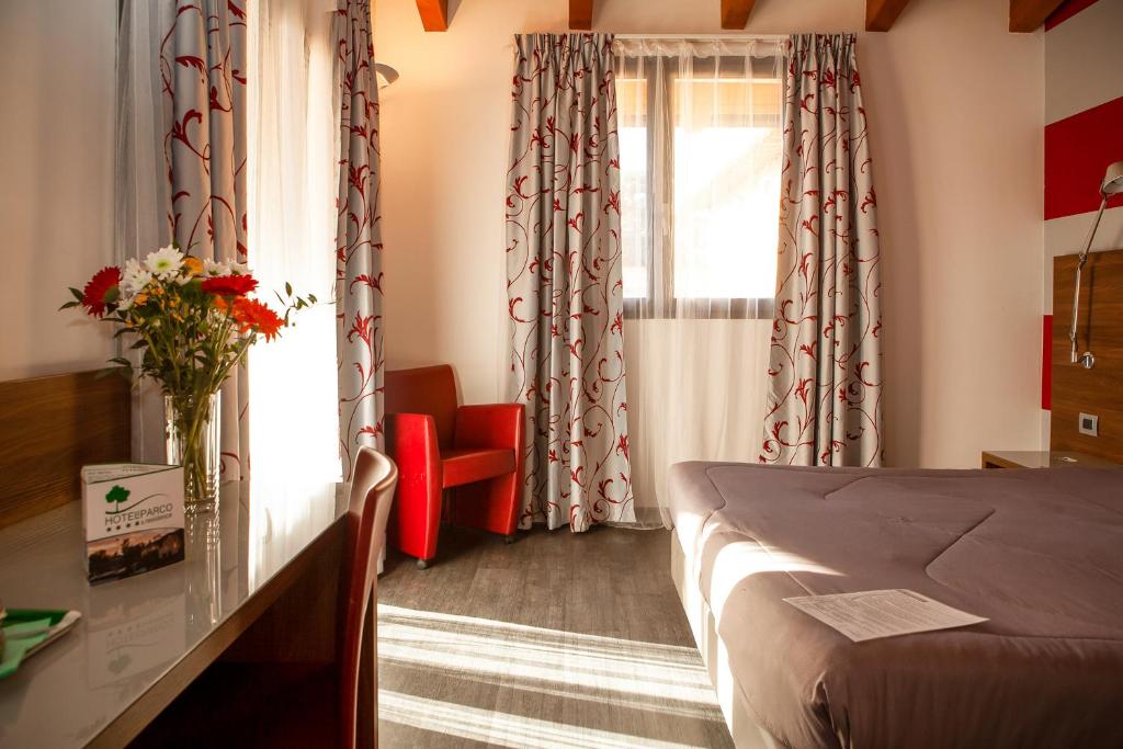 Postel nebo postele na pokoji v ubytování Hotel Del Parco