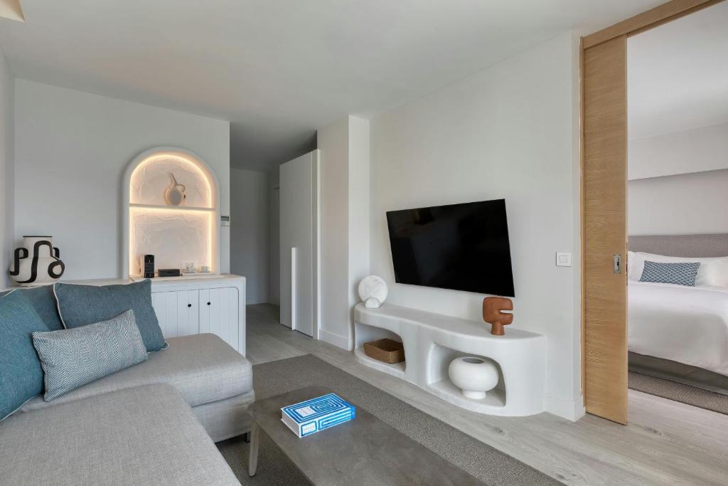 A television and/or entertainment centre at Patmos Aktis, a Luxury Collection Resort & Spa, Greece