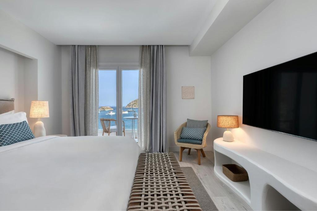 A bed or beds in a room at Patmos Aktis, a Luxury Collection Resort & Spa, Greece