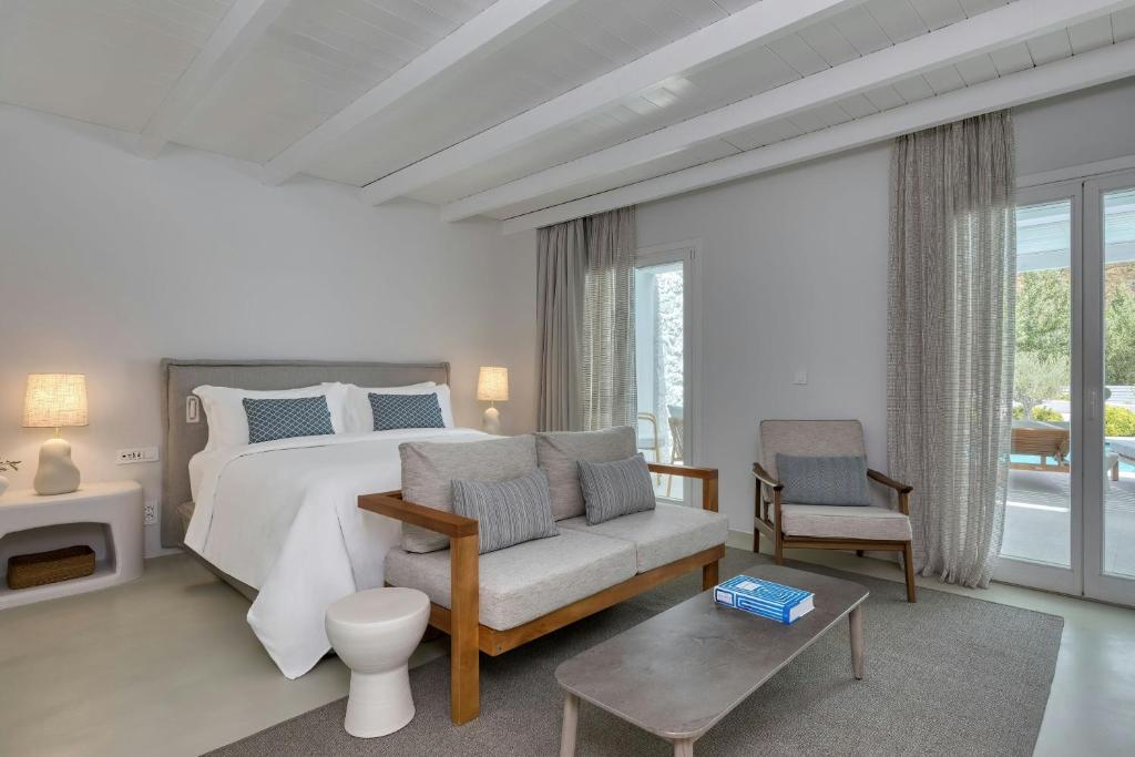 A bed or beds in a room at Patmos Aktis, a Luxury Collection Resort & Spa, Greece
