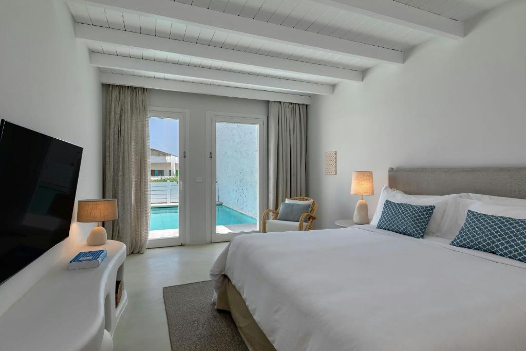 A bed or beds in a room at Patmos Aktis, a Luxury Collection Resort & Spa, Greece