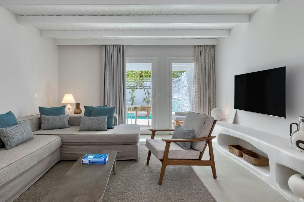 A television and/or entertainment centre at Patmos Aktis, a Luxury Collection Resort & Spa, Greece