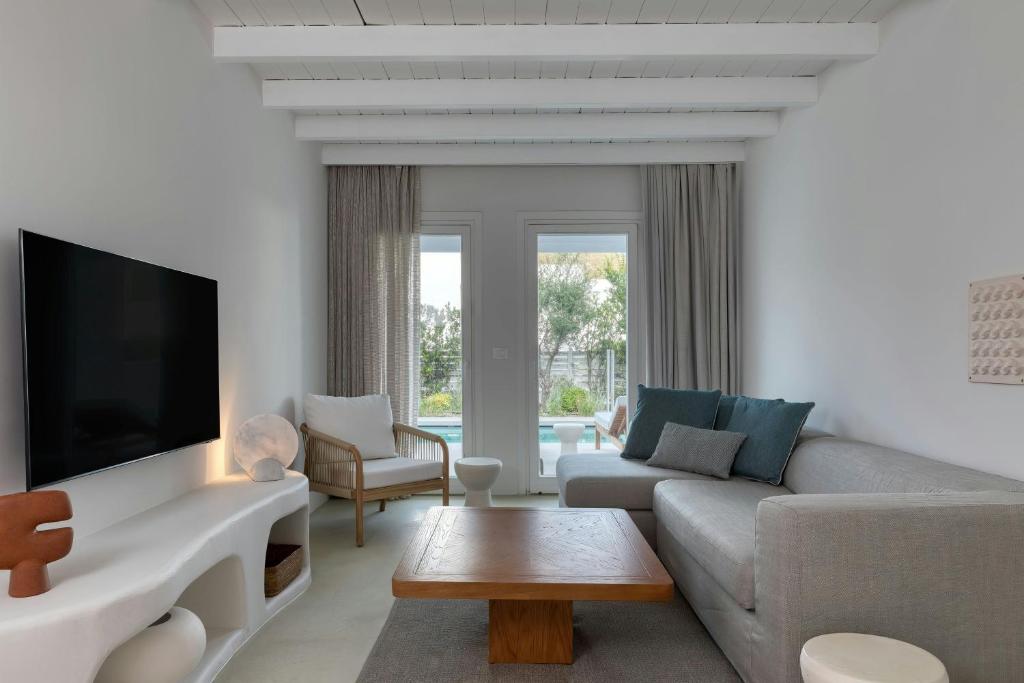 A television and/or entertainment centre at Patmos Aktis, a Luxury Collection Resort & Spa, Greece
