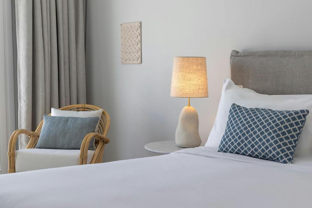 A bed or beds in a room at Patmos Aktis, a Luxury Collection Resort & Spa, Greece