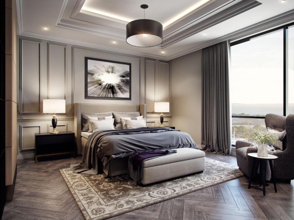 a bedroom with a bed and a large window at ATRIA Mega Almaty in Almaty