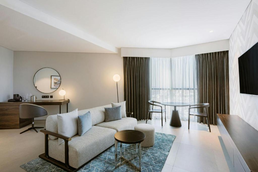 a living room with a couch and a table at Courtyard by Marriott World Trade Centre, Dubai in Dubai