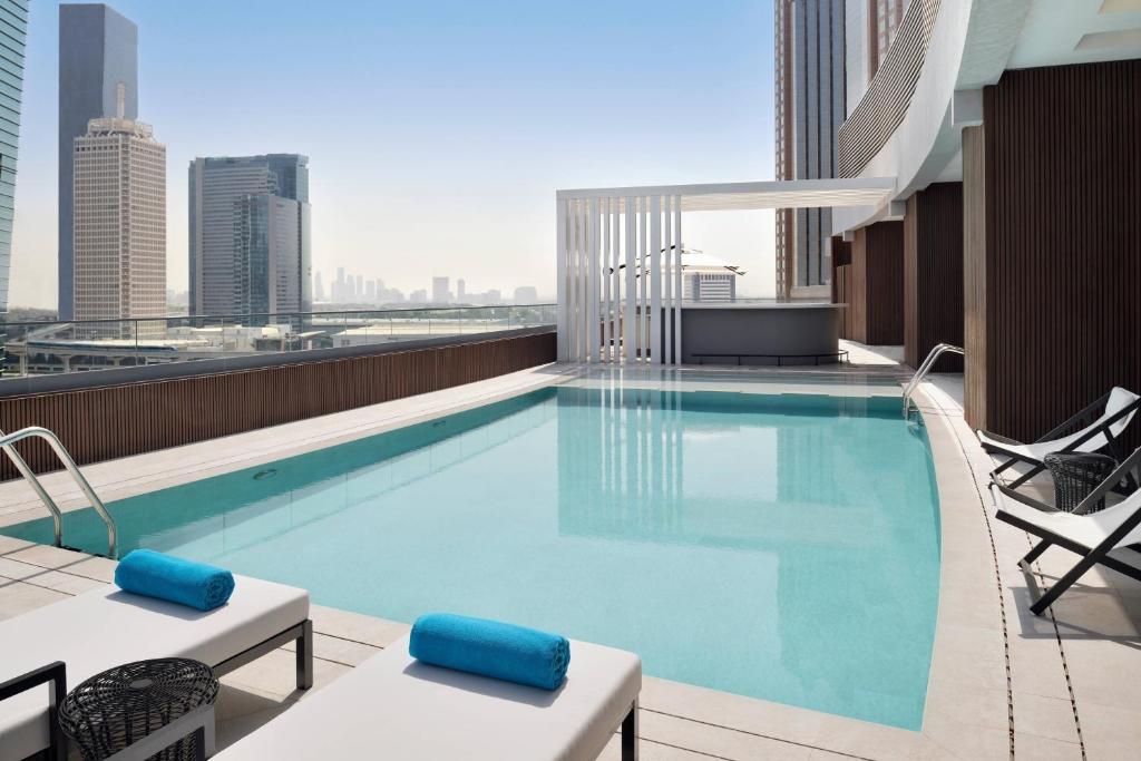 a swimming pool on the roof of a building at Courtyard by Marriott World Trade Centre, Dubai in Dubai
