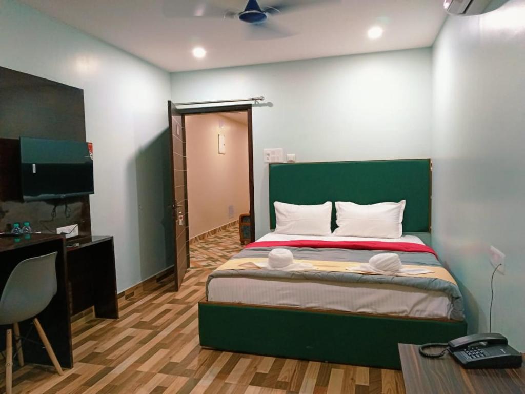 Postel nebo postele na pokoji v ubytování Hotel HK Regency