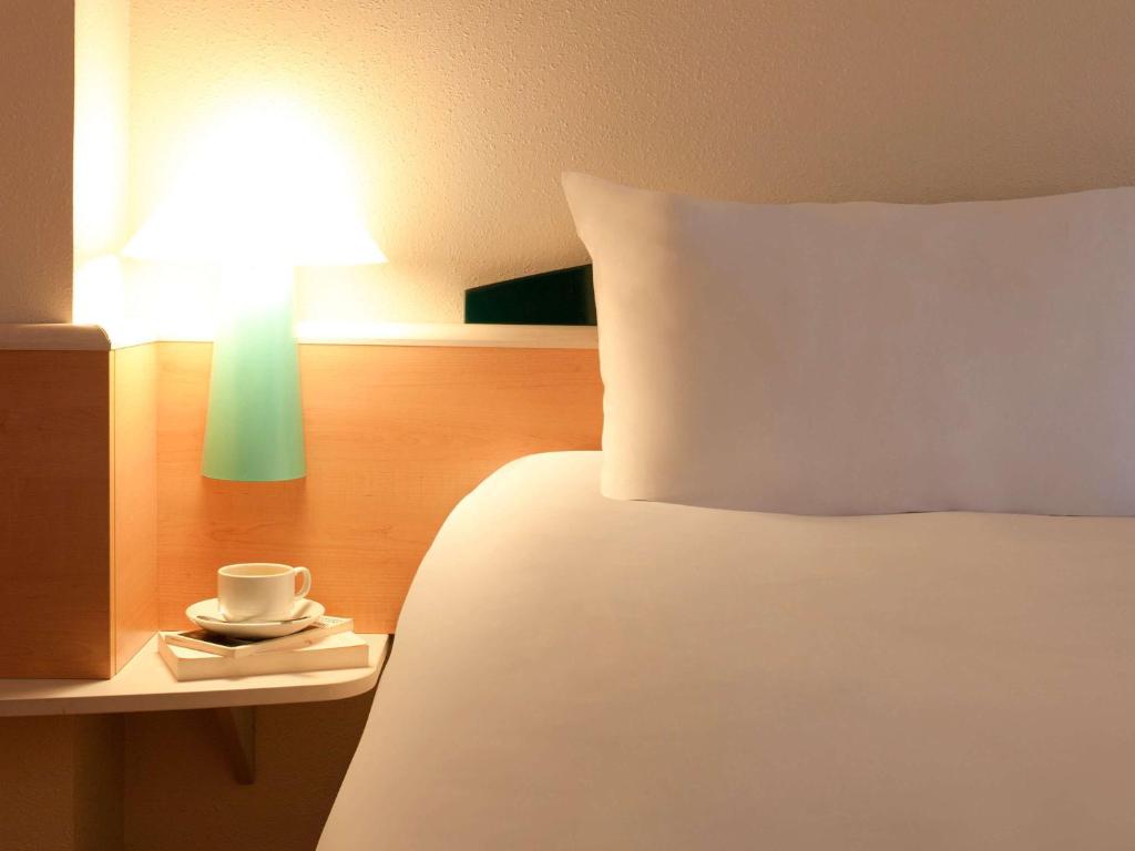 Postel nebo postele na pokoji v ubytování Ibis Bilbao Barakaldo