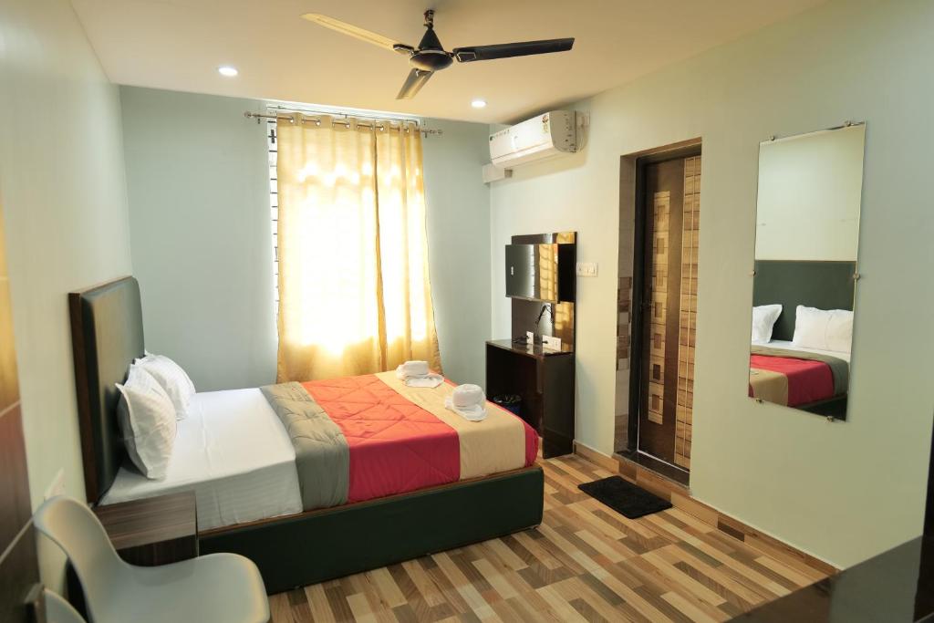 Postel nebo postele na pokoji v ubytování Hotel HK Regency