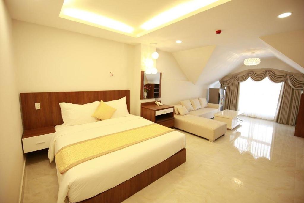 Giường trong phòng chung tại Kim Hoa Hotel