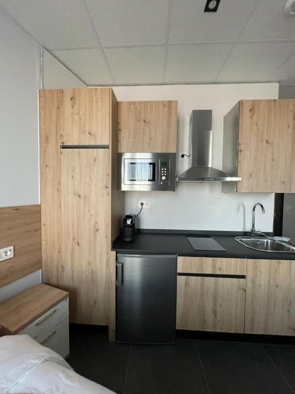 Kuchyň nebo kuchyňský kout v ubytování Apartamentos - Mirasur