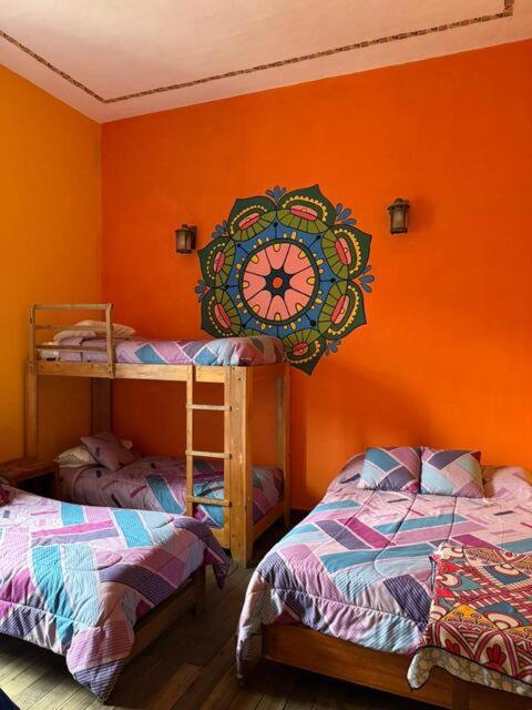 Postel nebo postele na pokoji v ubytování Hostal Café Tiana