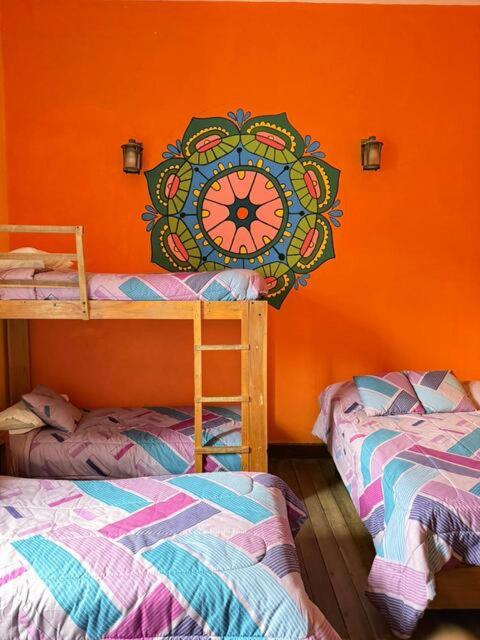 Postel nebo postele na pokoji v ubytování Hostal Café Tiana