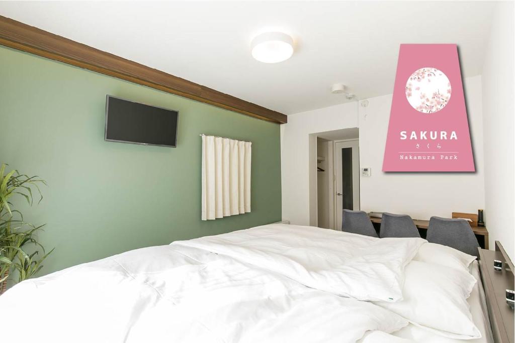 Postel nebo postele na pokoji v ubytování -SAKURA- Vacation Rental