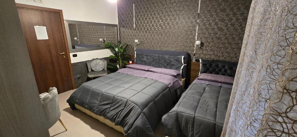 Postel nebo postele na pokoji v ubytování Villa Nancy