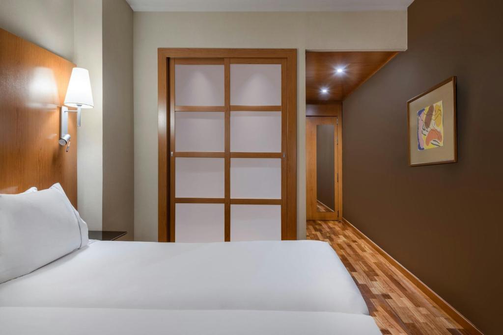 Postel nebo postele na pokoji v ubytování AC Hotel León San Antonio by Marriott