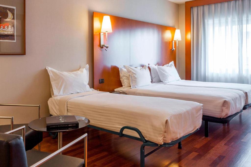 Postel nebo postele na pokoji v ubytování AC Hotel León San Antonio by Marriott