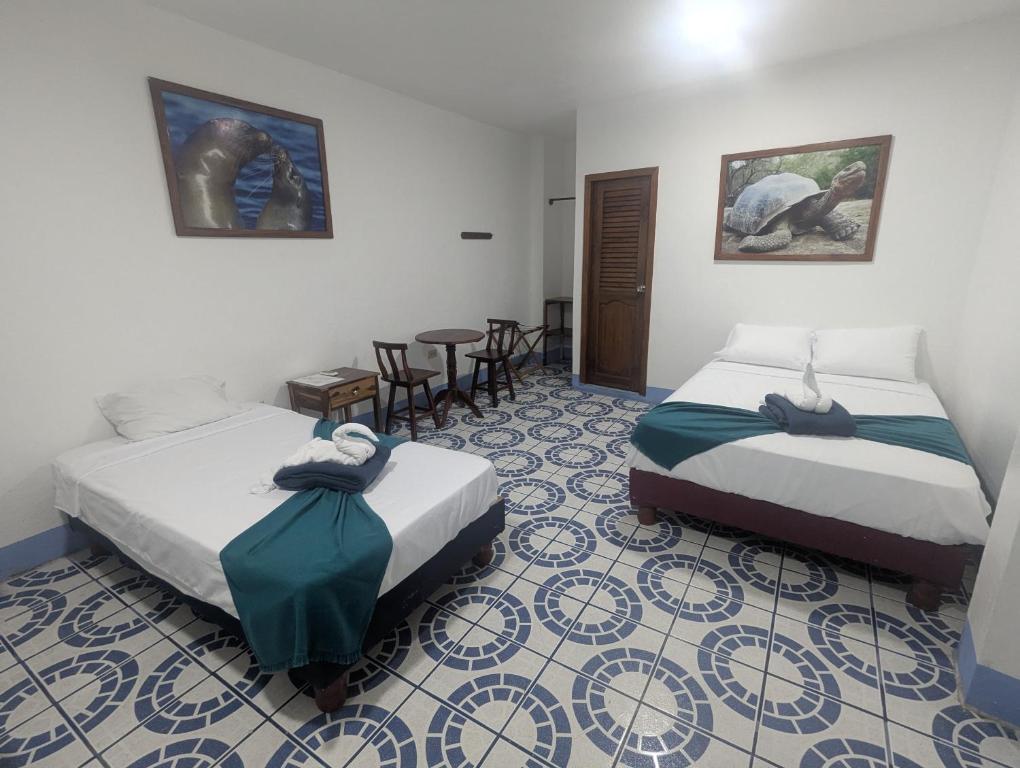 Postel nebo postele na pokoji v ubytování Hostal Gardner