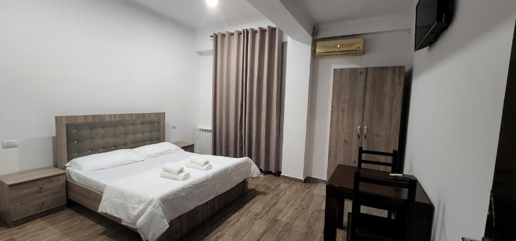 Postel nebo postele na pokoji v ubytování Hotel Kleo