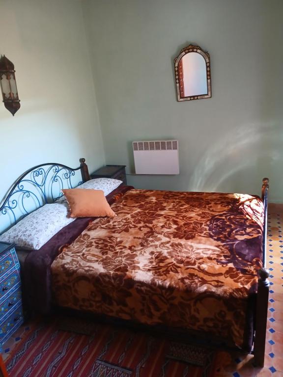 Postel nebo postele na pokoji v ubytování Riad Idrissi